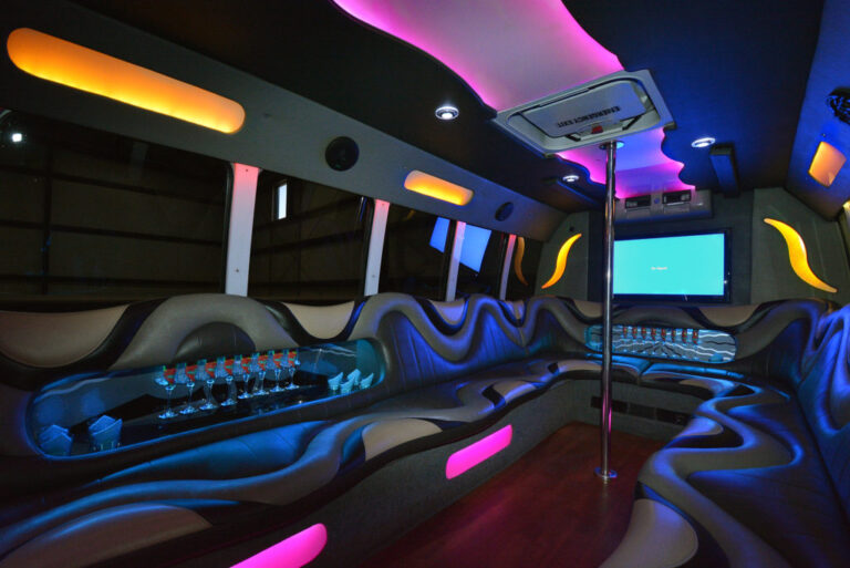 Party bus interior with lounge seating and lighting